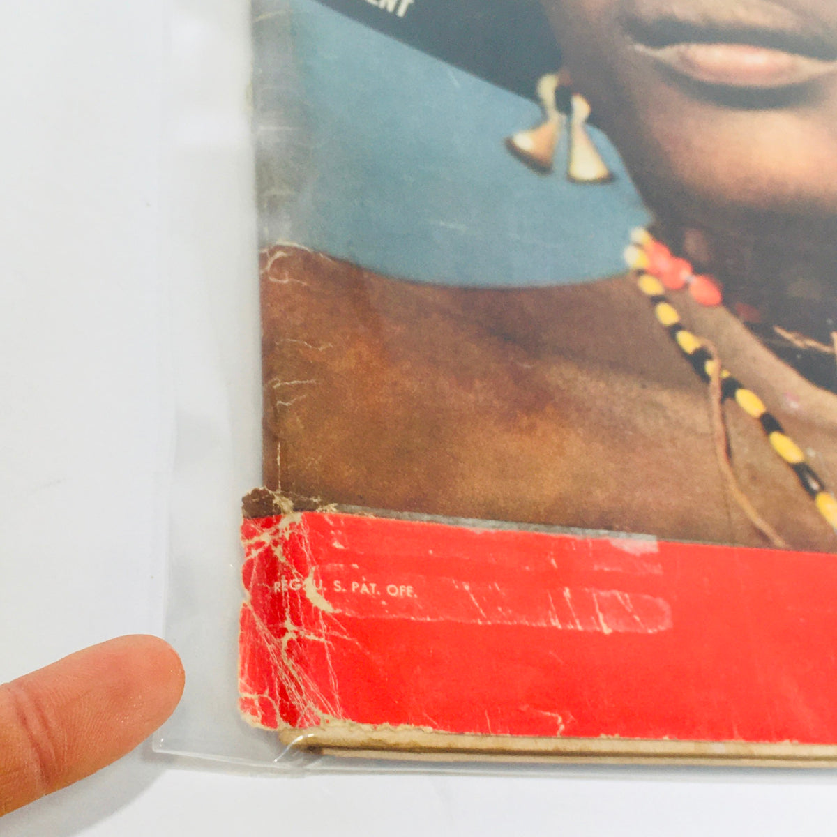 Close-up image of the bottom edge of the vintage Life Magazine cover from May 4, 1953, showcasing wear and tear on the magazine with the title 'Africa, A Continent in Ferment.' Includes visible signs of aging typical for vintage collectibles.
