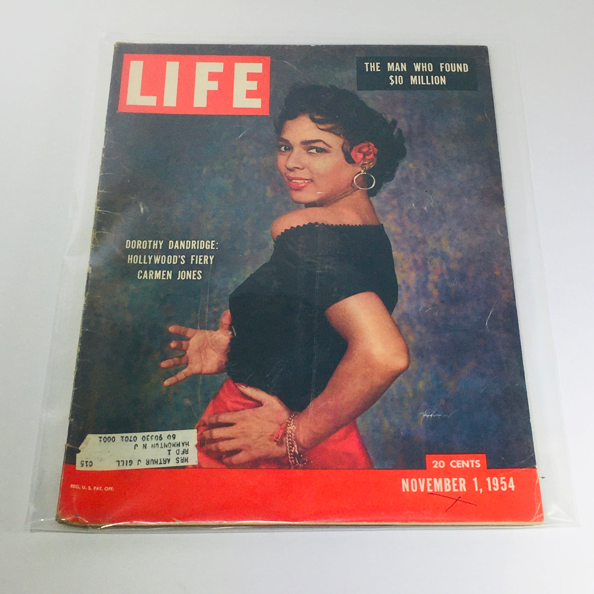 VTG Life Magazine: Nov 1 1954 featuring a captivating cover image of Dorothy Dandridge, portraying her iconic role as Carmen Jones, with the headline 'The Man Who Found $10 Million'. This vintage magazine showcases mid-20th century America.