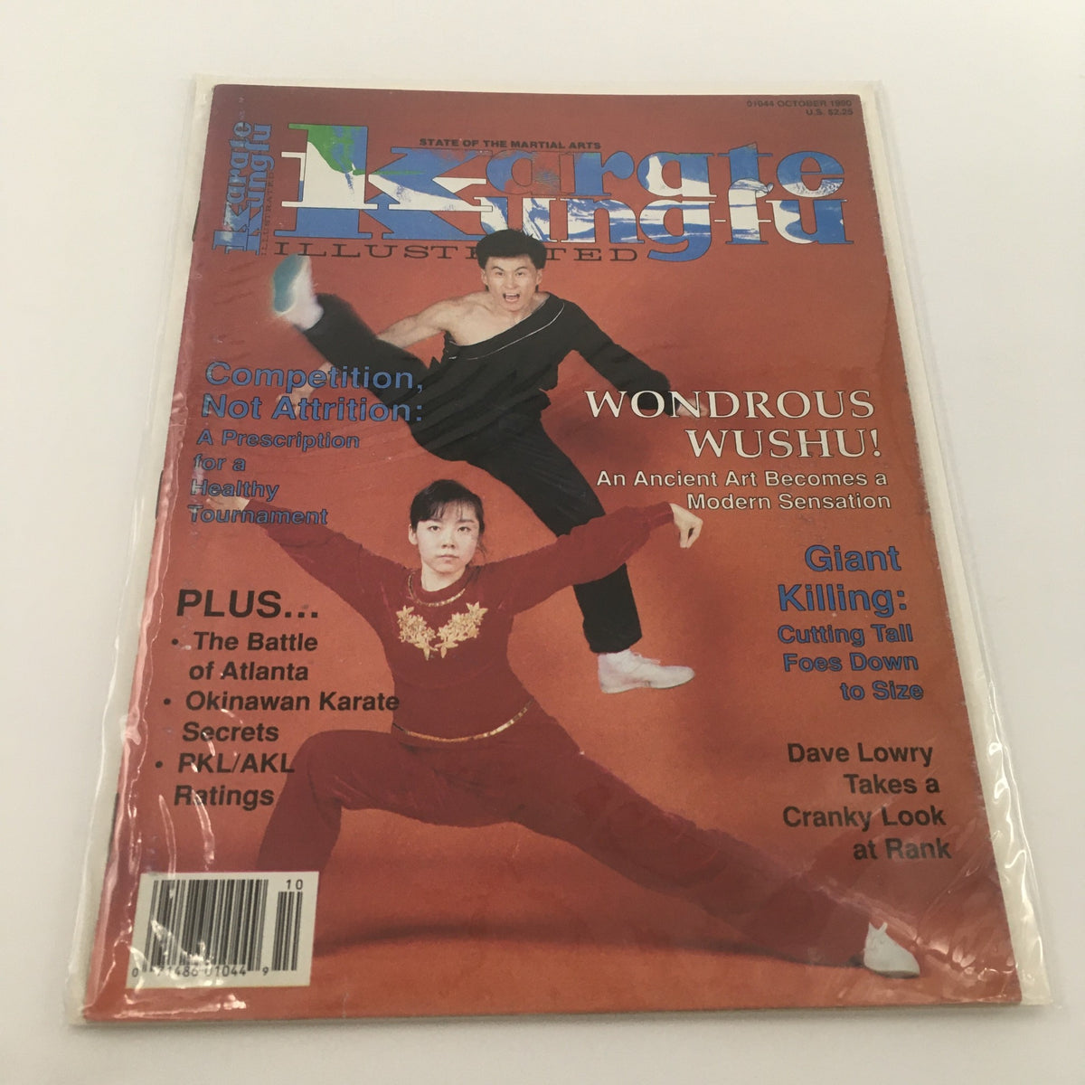 Cover of Karate Kung Fu Illustrated October 1990 featuring martial artists and the title, showcasing topics such as 'Wondrous Wushu' and insights from Dave Lowry.