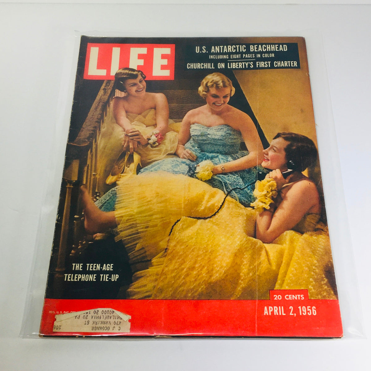Life Magazine from April 2, 1956, featuring the cover story 'Teen-Age Telephone Tie-Up' with three women in colorful dresses, showcasing mid-century fashion and culture alongside the article on 'U.S. Antarctic Beachhead'.