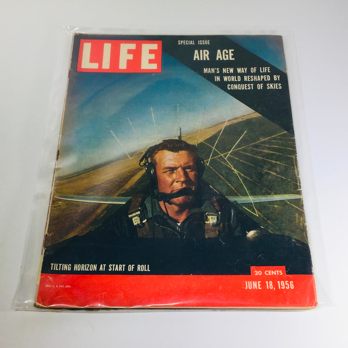 Cover of Life Magazine, June 18, 1956, featuring the title 'Tilting Horizon at Start of Roll / Air Age'. The image showcases a pilot in an aircraft cockpit with a focus on aviation themes and the significant advancements during the mid-20th century.