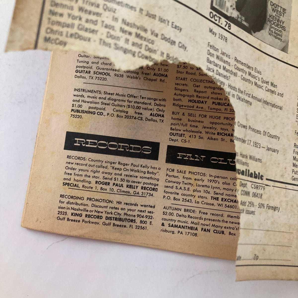 Close-up of an advertisement and contact information page from the VTG Country Song Roundup Magazine July 1979, providing insights into record promotions and fan clubs related to country music artists.