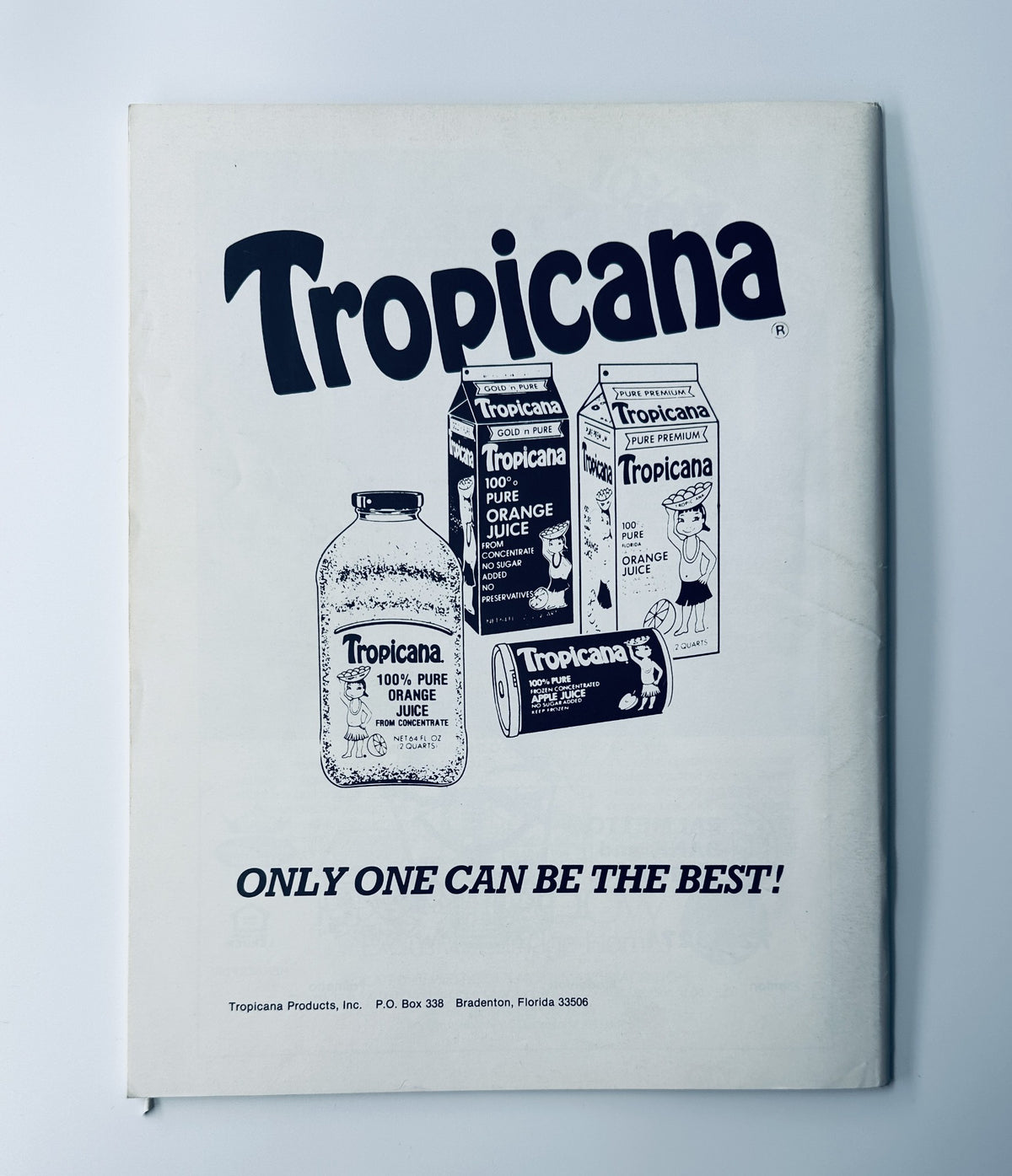 Image of a vintage advertisement for Tropicana products featured in the Miss Manatee County Scholarship Pageant Magazine, November 19, 1983, promoting their orange juice with the slogan 'ONLY ONE CAN BE THE BEST!'.