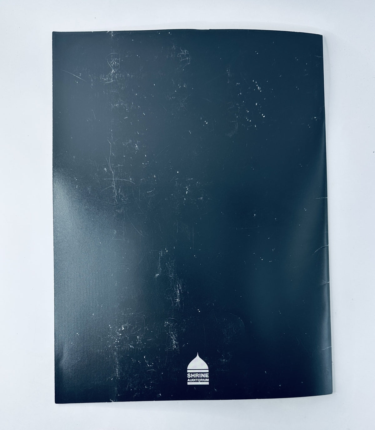 Back cover of the official program for the 60th Annual Academy Awards, showcasing its condition with light wear.
