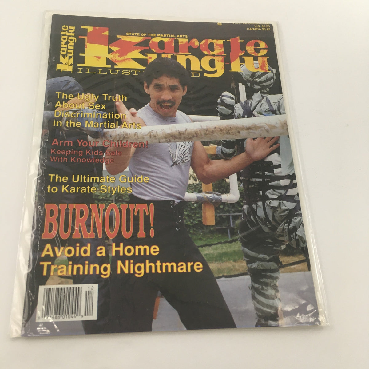 Cover of December 1990 issue of Karate Kung Fu Illustrated featuring Mike Young, showcasing headlines about sex discrimination in martial arts, child safety in martial arts, and a guide to karate styles.