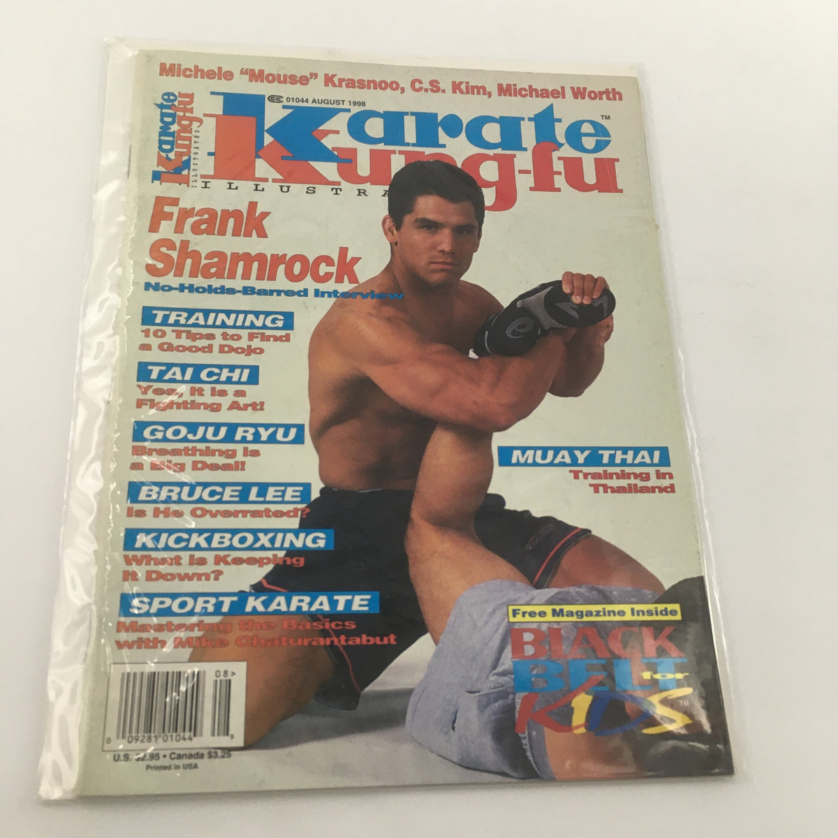 Karate Kung Fu Illustrated magazine cover from August 1998 featuring Frank Shamrock in a no-holds-barred interview, showcasing martial arts topics including training tips, Tai Chi, Goju Ryu, Bruce Lee, kickboxing, and sport karate. Includes mention of a free magazine inside and is in very good condition, bagged and boarded.