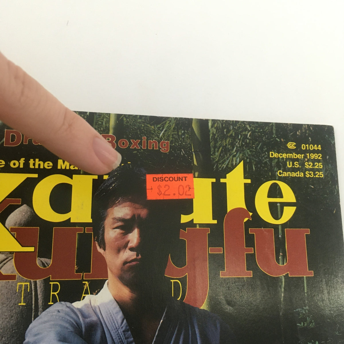 Close-up of the Karate Kung Fu Illustrated December 1992 magazine cover highlighting the price discount sticker, emphasizing its collectible nature.
