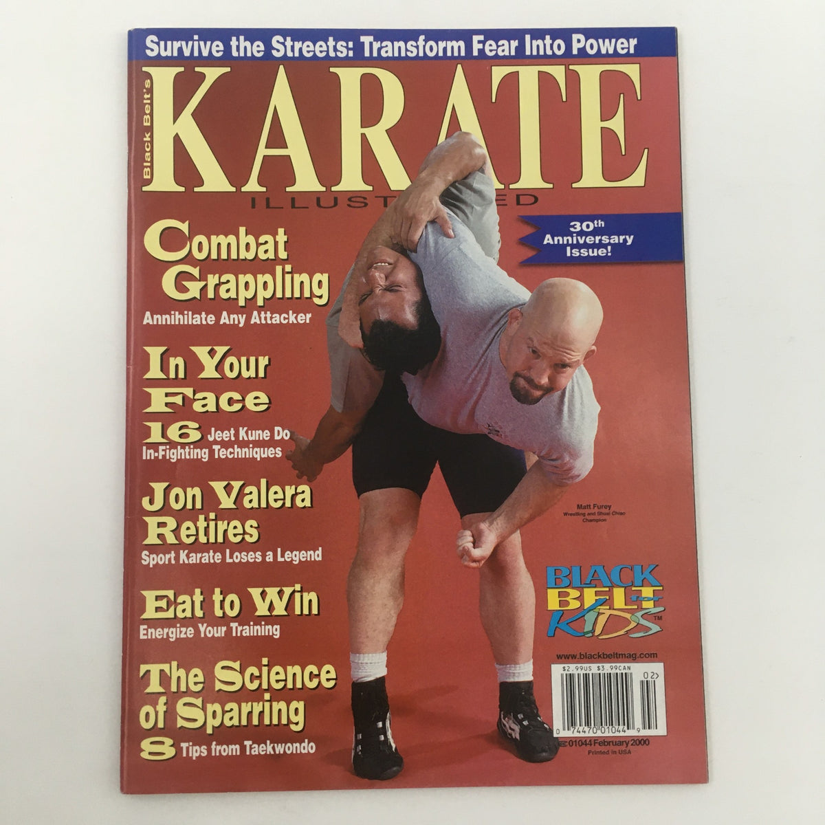 Cover of Karate Illustrated Magazine February 2000 featuring Matt Furey, a Shuai Chiao champion. The magazine showcases martial arts themes including combat grappling and self-defense techniques, celebrating its 30th Anniversary.