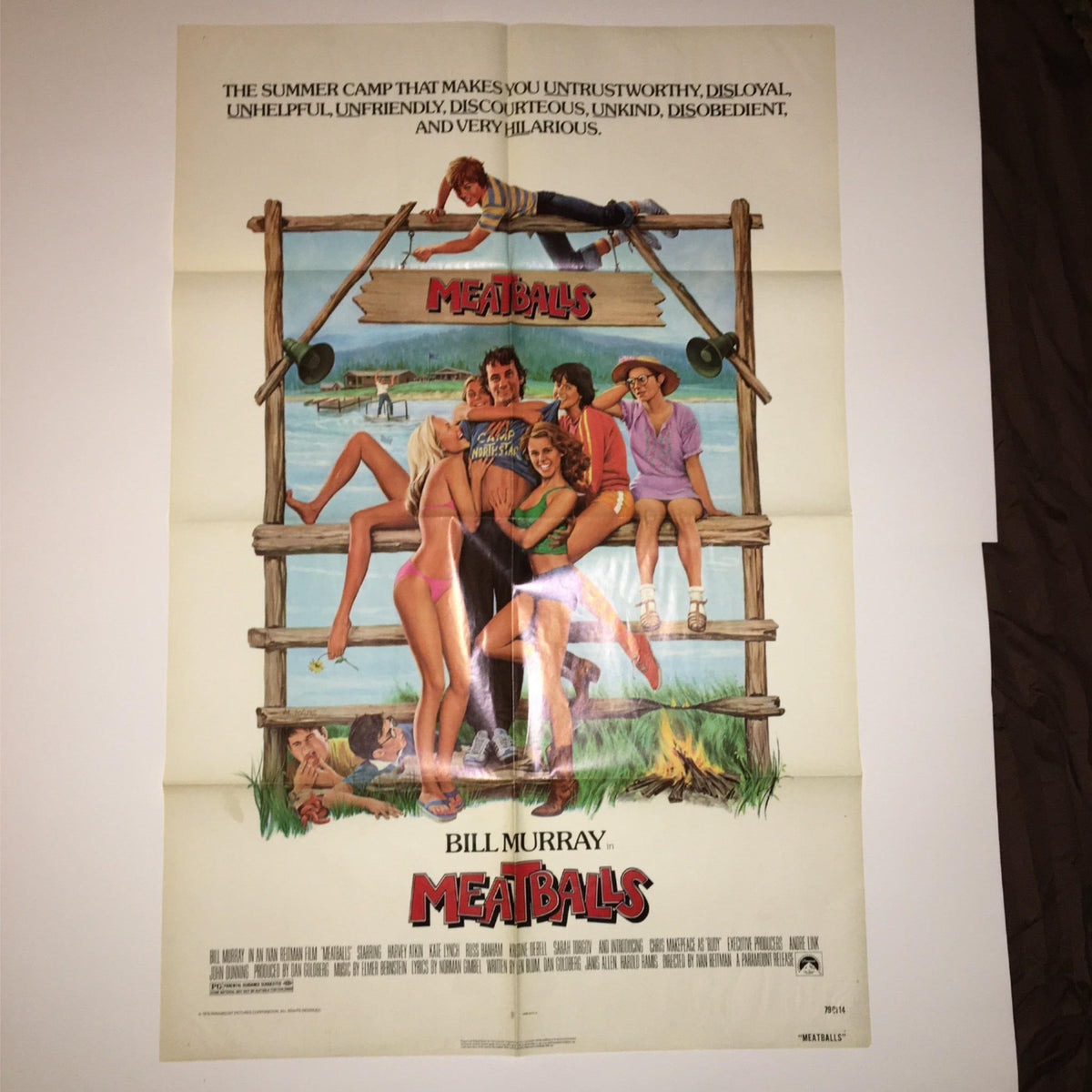 1979 MeatBalls 27 x 41 Original Movie Poster features the iconic artwork of Bill Murray and camp antics in a colorful summer setting.