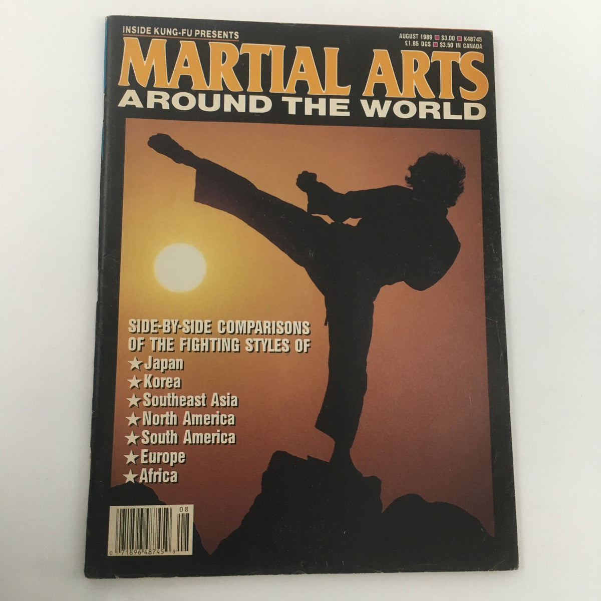 Martial Arts Around The World August 1989 magazine cover featuring a silhouette of a martial artist performing a kick against a sunset background, highlighting various fighting styles from Japan, Korea, Southeast Asia, North America, South America, Europe, and Africa.