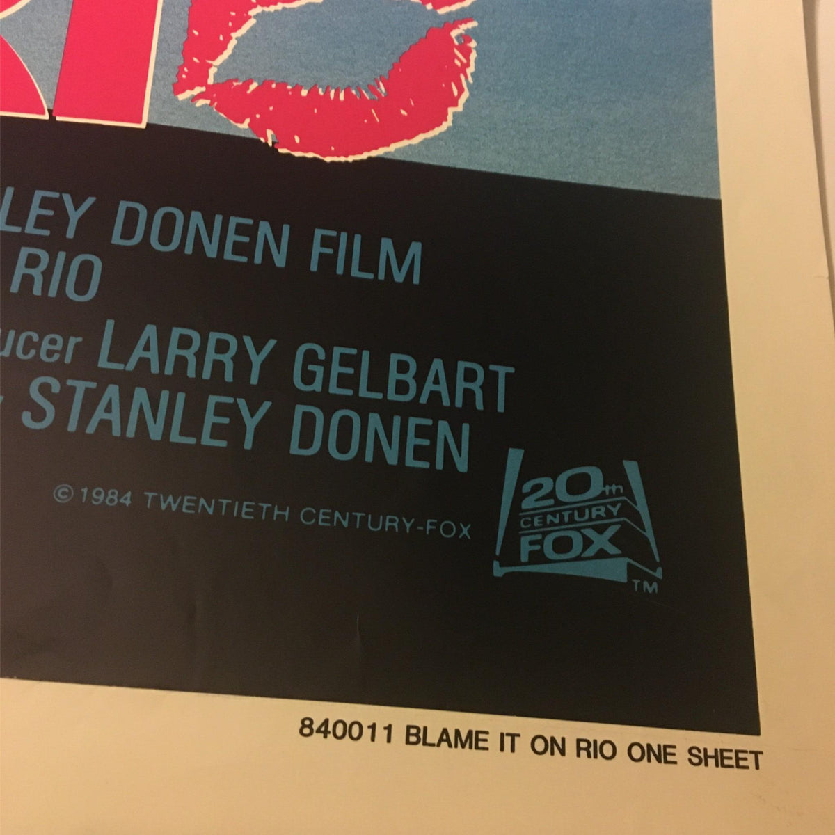 Detailed shot of the lower section of the 1984 Blame it on Rio movie poster, emphasizing the film credits and branding from 20th Century Fox.