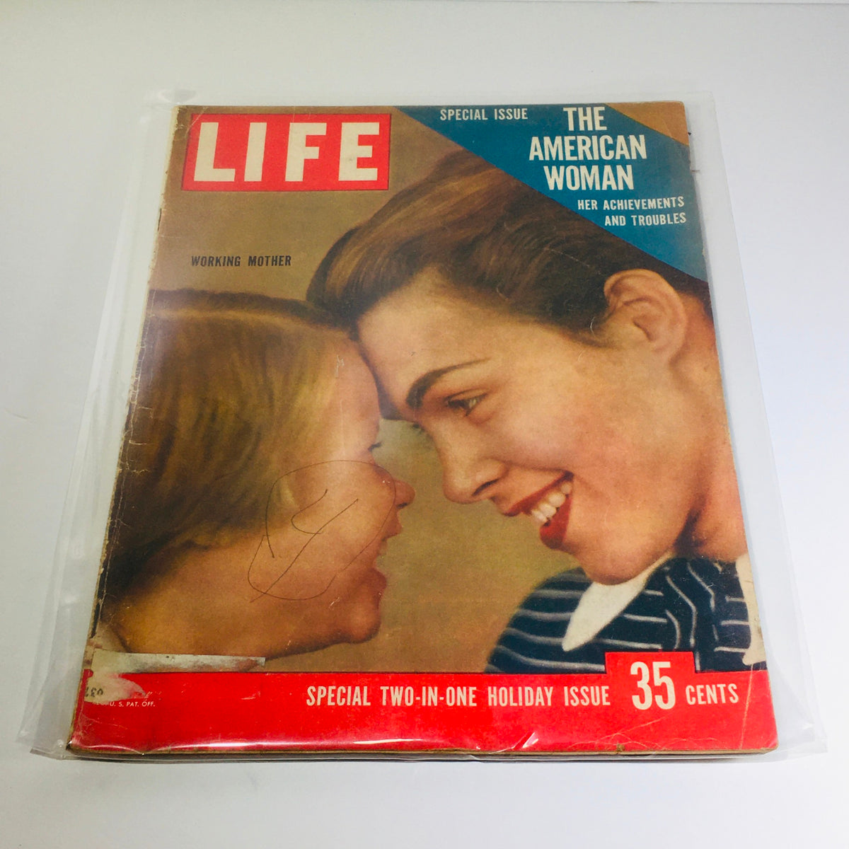 Front cover of VTG Life Magazine from December 24, 1956 featuring the special issue on The American Woman and Working Mother, showcasing two women smiling at each other.