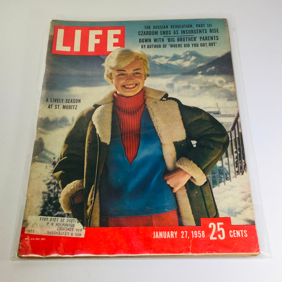 Cover of VTG Life Magazine: January 27, 1958 featuring a smiling woman in winter attire at St. Moritz, highlighting themes of a lively season and the end of Czardom.