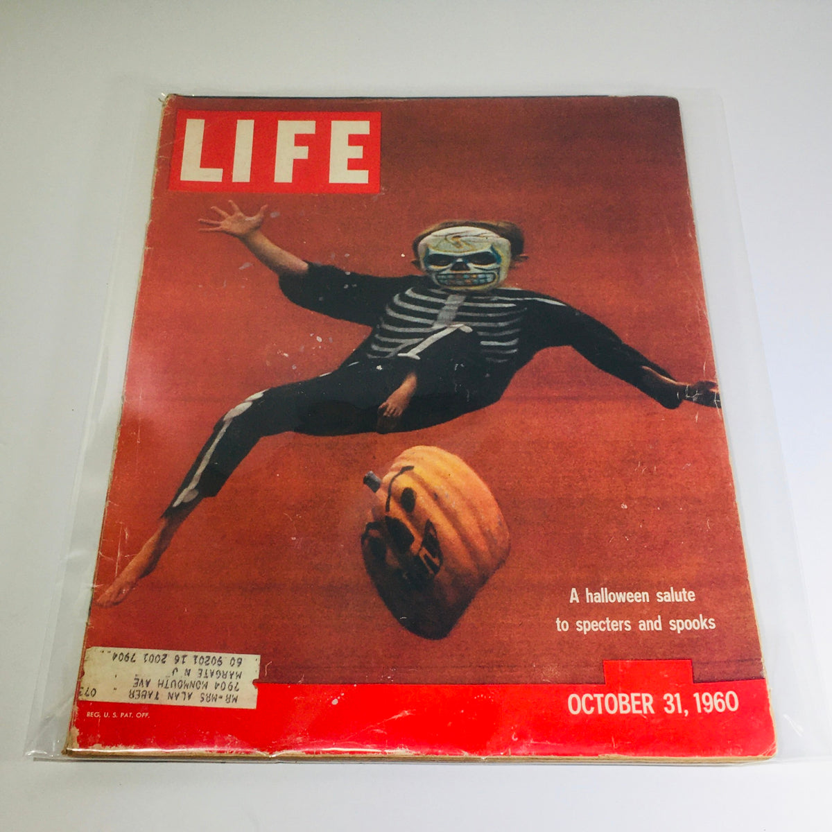 Cover of VTG Life Magazine: October 31, 1960 featuring a child in a skeleton costume and a pumpkin, showcasing a Halloween Salute To Specters and Spooks.