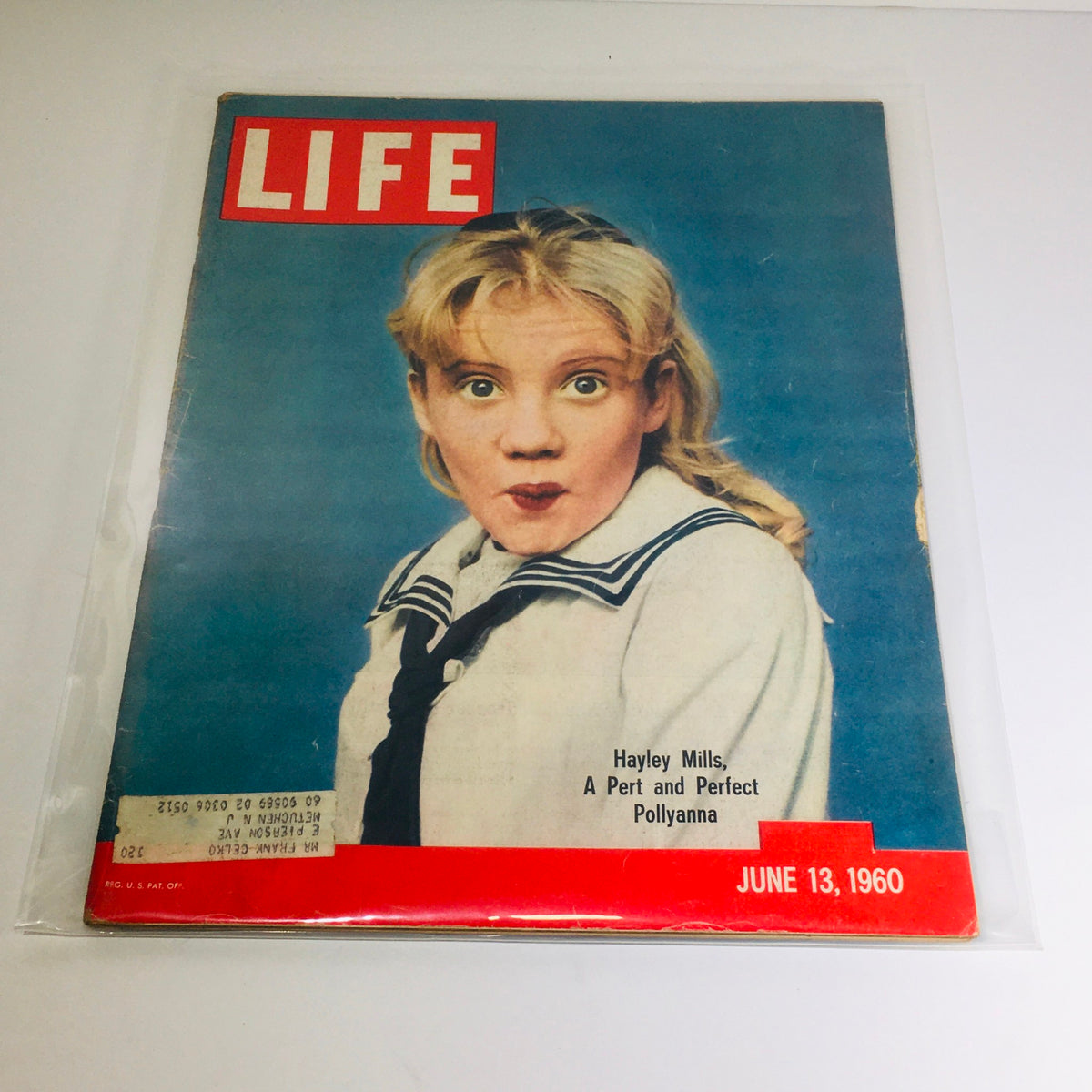 Vintage Life Magazine cover featuring Hayley Mills, June 13, 1960 - A Pert and Perfect Pollyanna, showcasing the prominent title and colorful imagery.