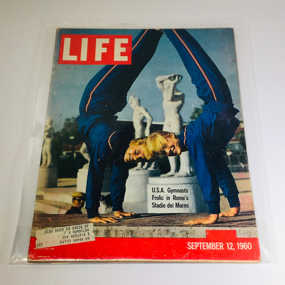 Vintage Life Magazine from September 12, 1960, featuring USA Gymnasts frolicking at Rome's Stadio dei Marmi, showcasing athleticism and 1960s cultural spirit.