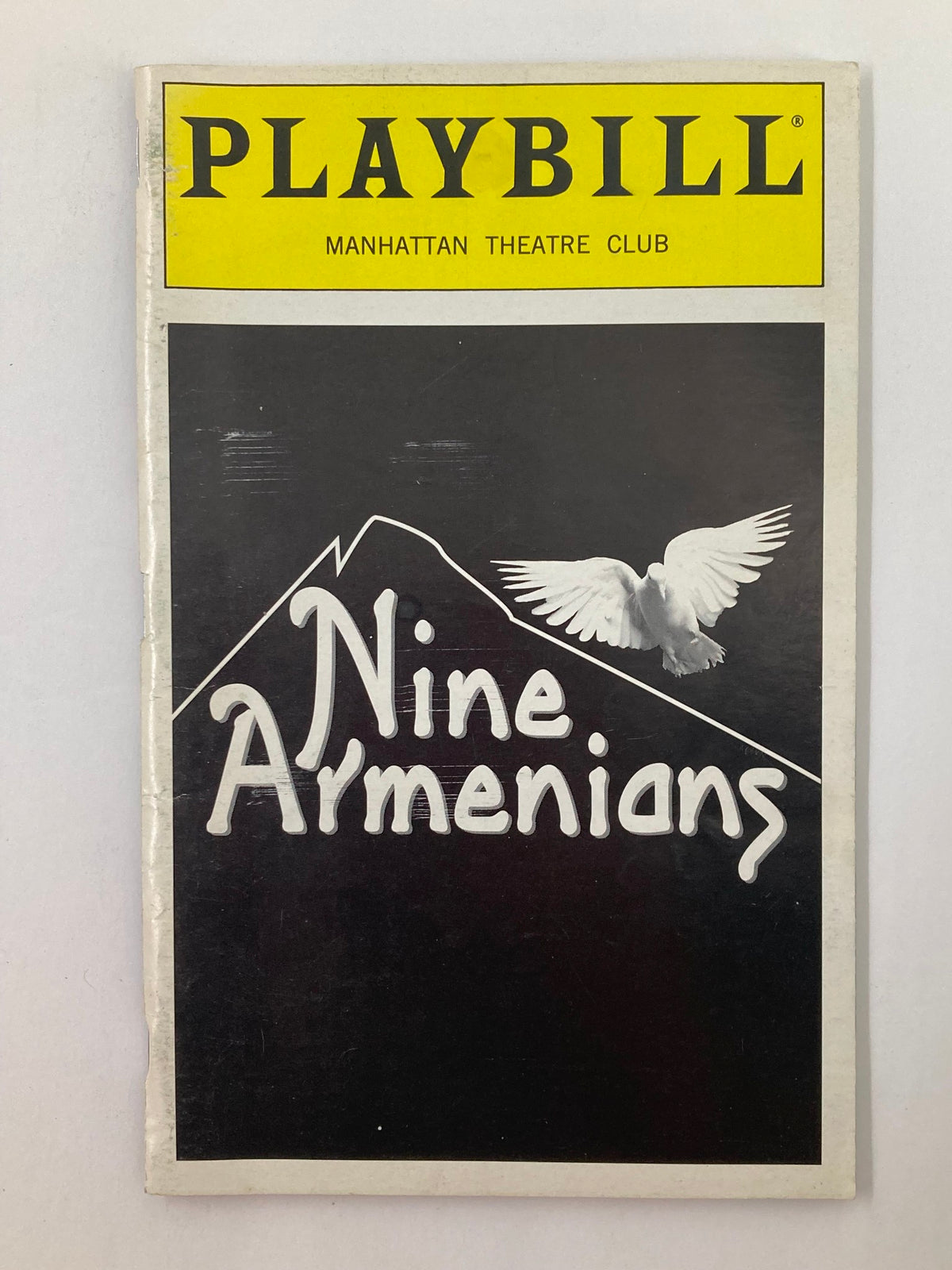 1996 Playbill Manhattan Theatre Club for the production 'Nine Armenians' featuring a black and white design with a white dove.