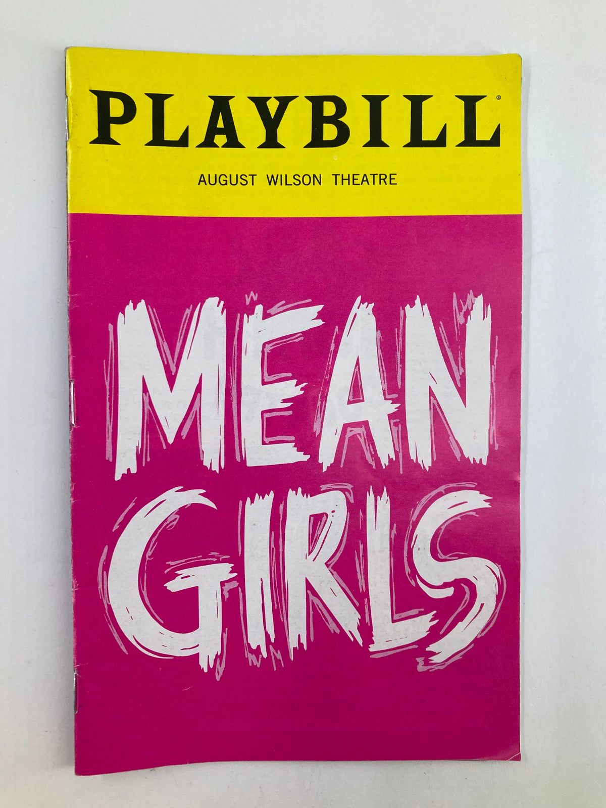 2020 Playbill August Wilson Theatre featuring Mean Girls with bold pink cover showcasing the title 'Mean Girls' in white text.
