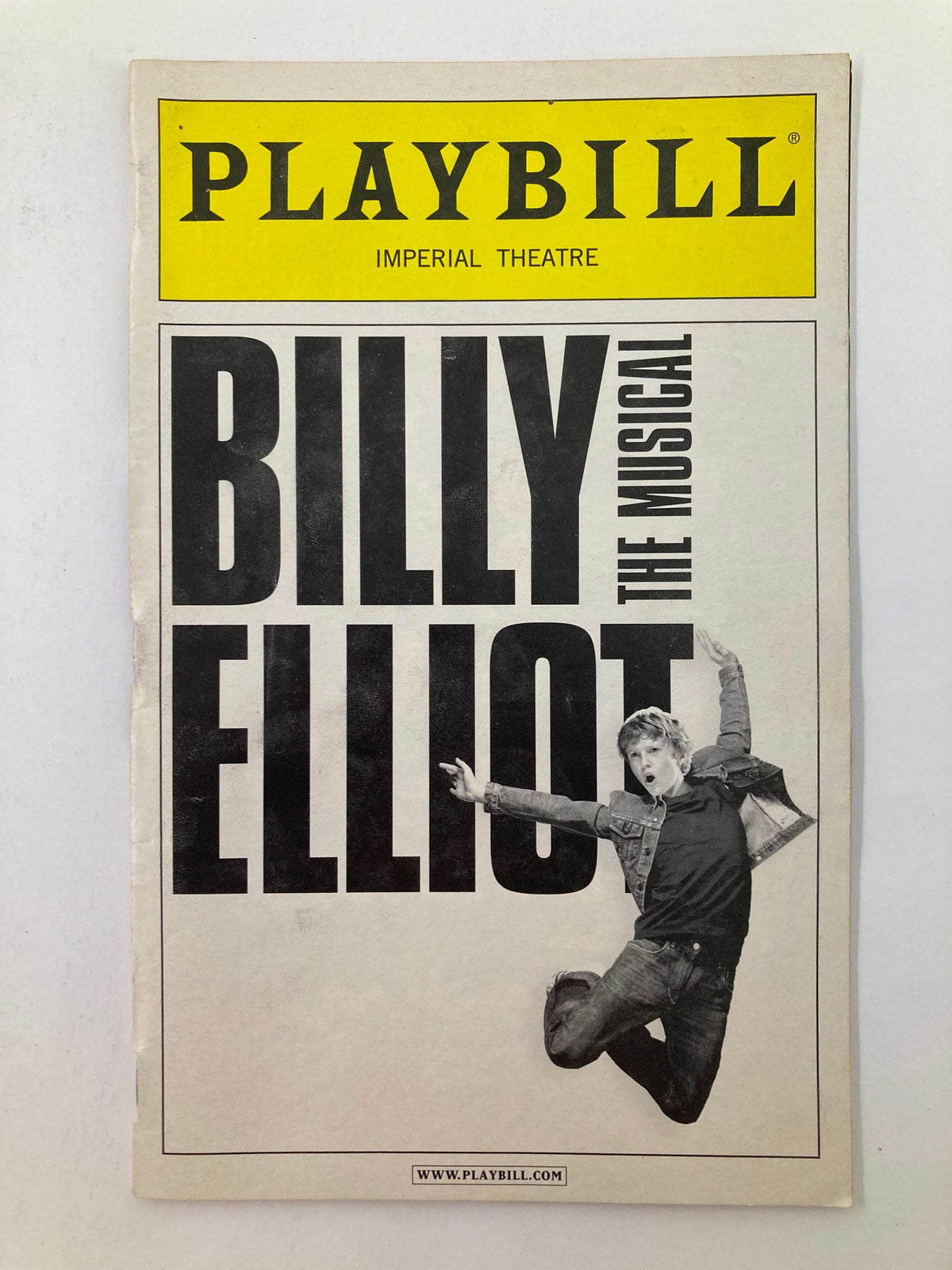 2010 Playbill from Billy Elliot The Musical at Imperial Theatre featuring the title prominently and an image of Jacob Clemente in a dynamic pose.