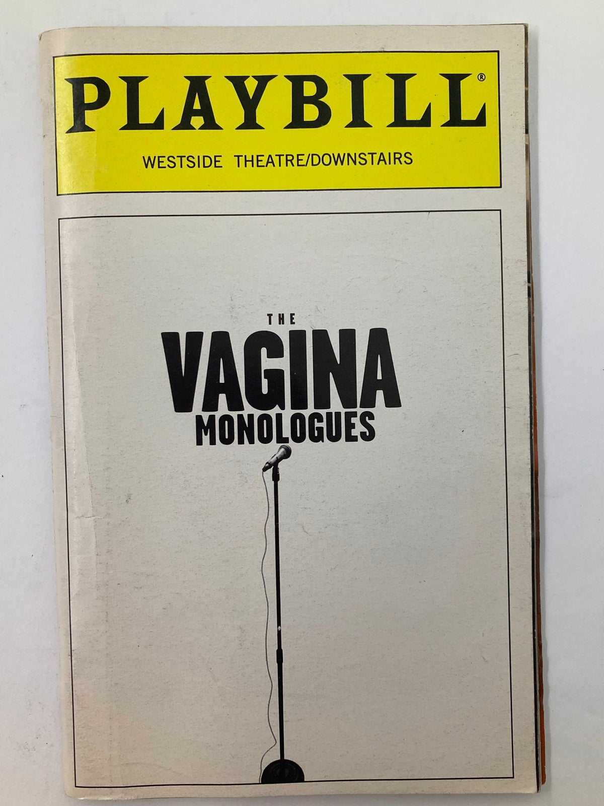 1999 Playbill from the Westside Theatre featuring The Vagina Monologues, showcasing a minimalist cover design with a microphone image.