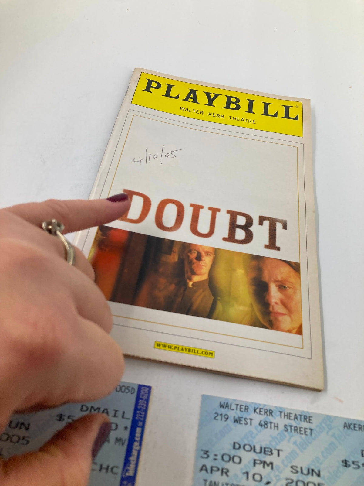 Close-up view of the 2005 Playbill from Walter Kerr Theatre for Doubt: A Parable with a handwritten date and adjacent tickets.
