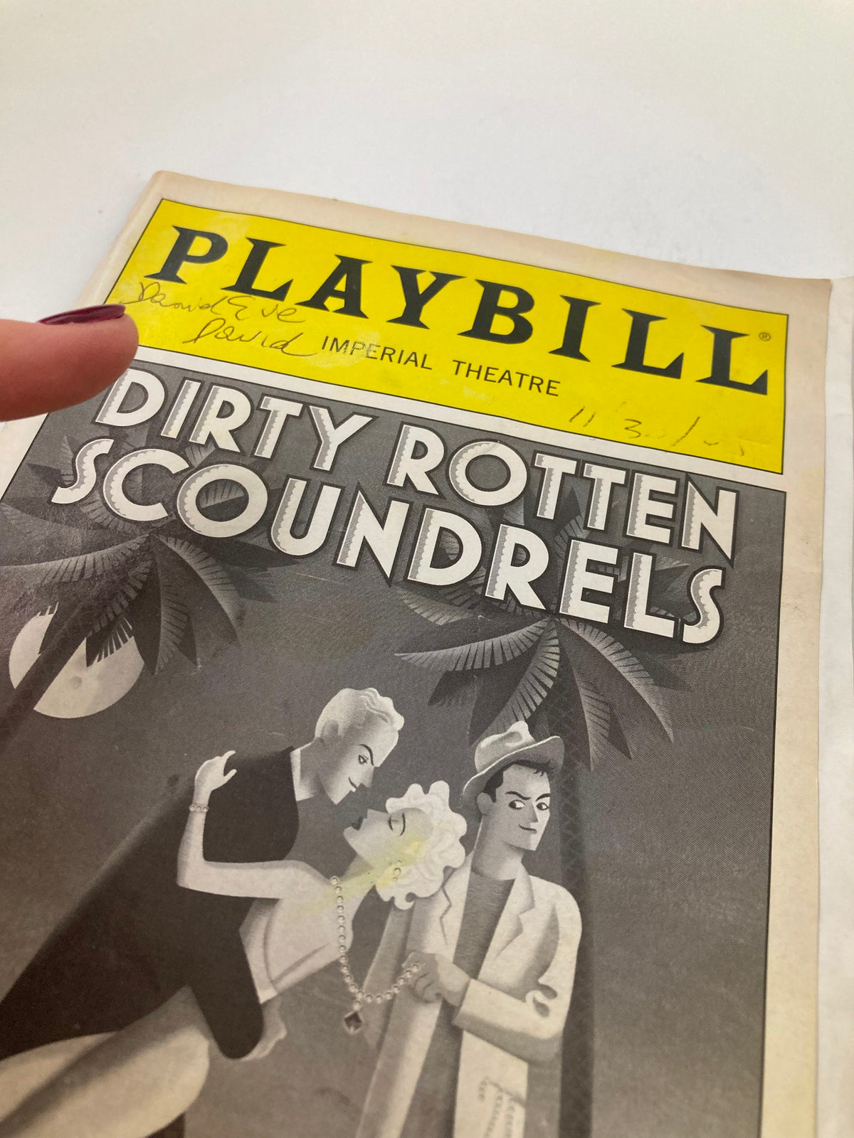 Front cover of the 2005 Playbill for Dirty Rotten Scoundrels at the Imperial Theatre, prominently featuring the show's title and illustrated characters.