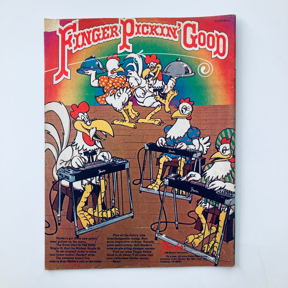 Cover of Finger Pickin' Good magazine depicting animated chickens playing musical instruments, showcasing a playful take on country music themes. Ideal for those interested in vintage music publications.