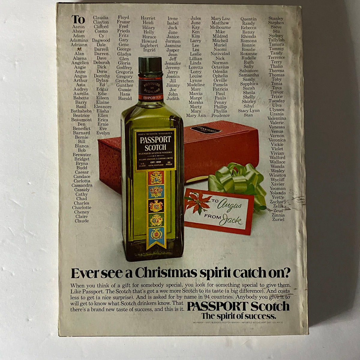 Advertisement page from Esquire Magazine December 1973, titled 'What's To Sing About this Christmas?', showcasing Passport Scotch and a gift package for the holidays.