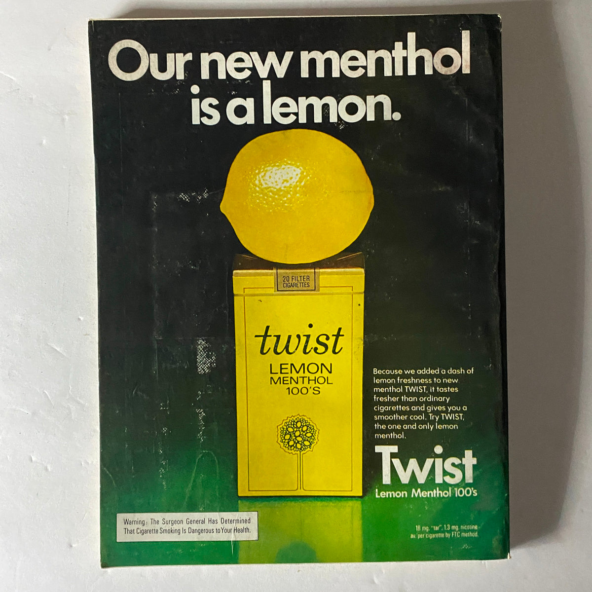 Esquire Magazine May 1974 displaying an advertisement for Twist Lemon Menthol cigarettes, featuring a vibrant image of a lemon and a description highlighting its refreshing flavor.