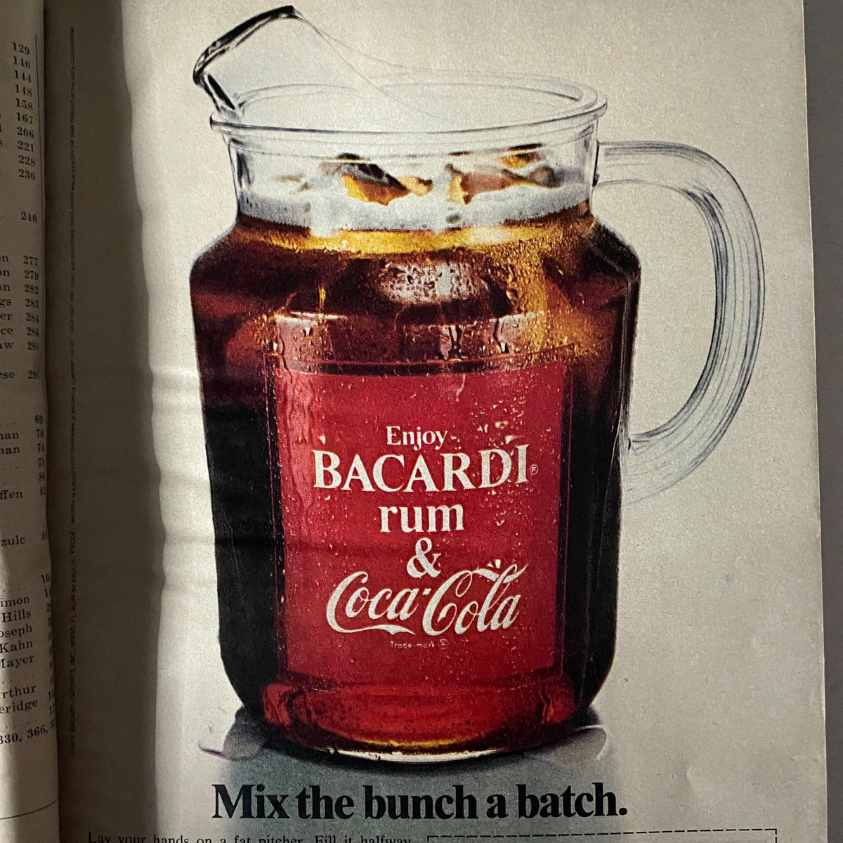Advertisement in Esquire Magazine October 1974 Super Sports Special promoting Bacardi rum and Coca-Cola, featuring a pitcher filled with the drink, indicative of the era's marketing style.
