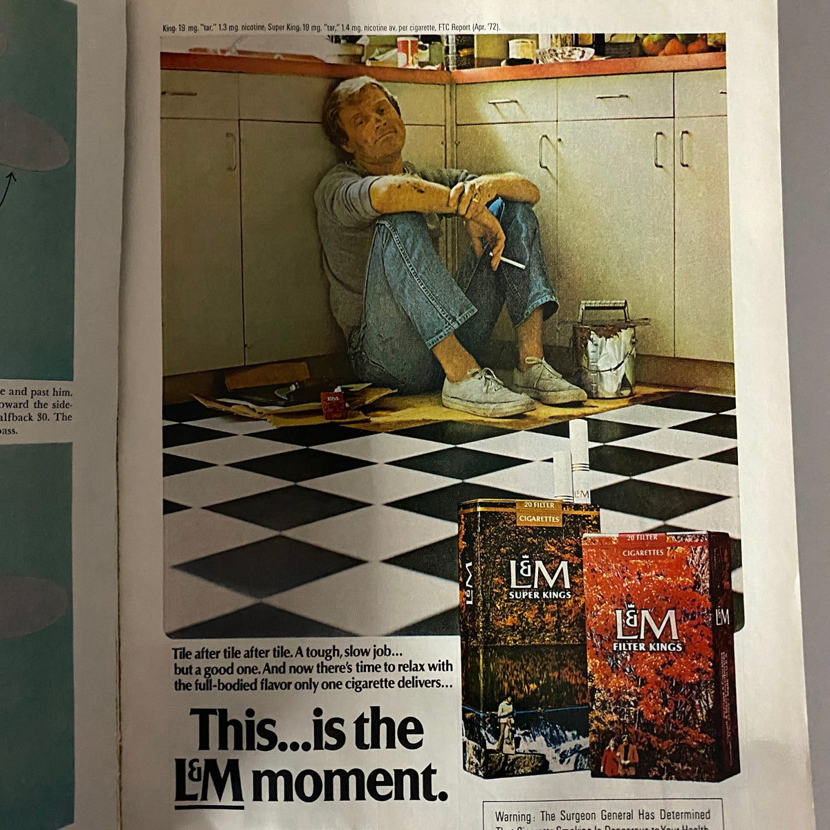 Esquire Magazine November 1972 advertisement featuring a man relaxing in a kitchen, promoting L&M cigarettes with the tagline "This...is the L&M moment."