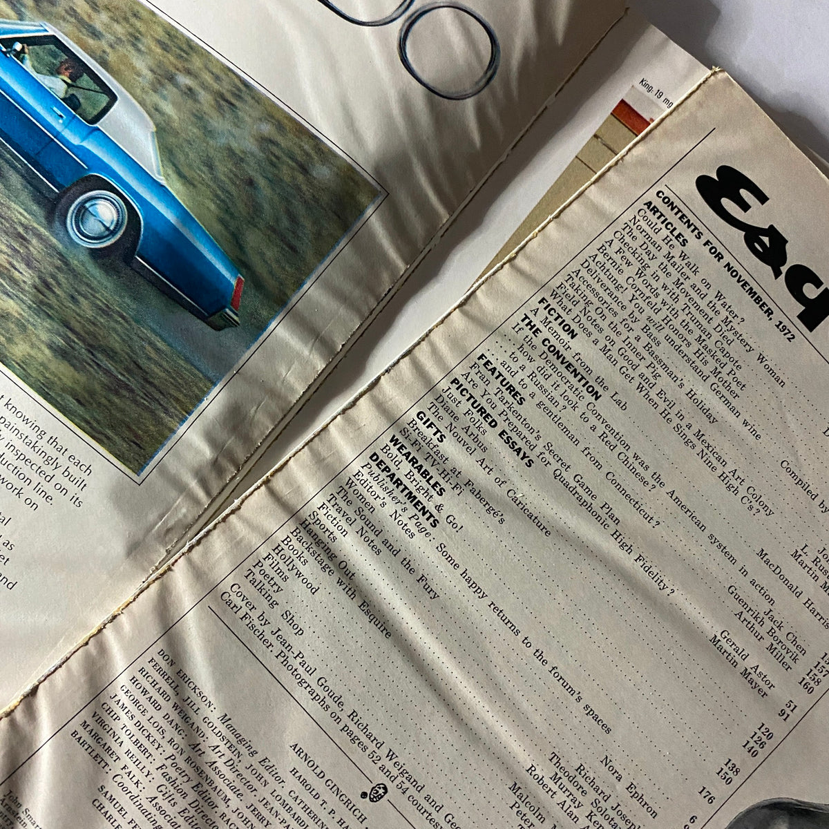 Esquire Magazine November 1972 interior page showing a blue car in motion, alongside the contents list featuring various articles and photography.
