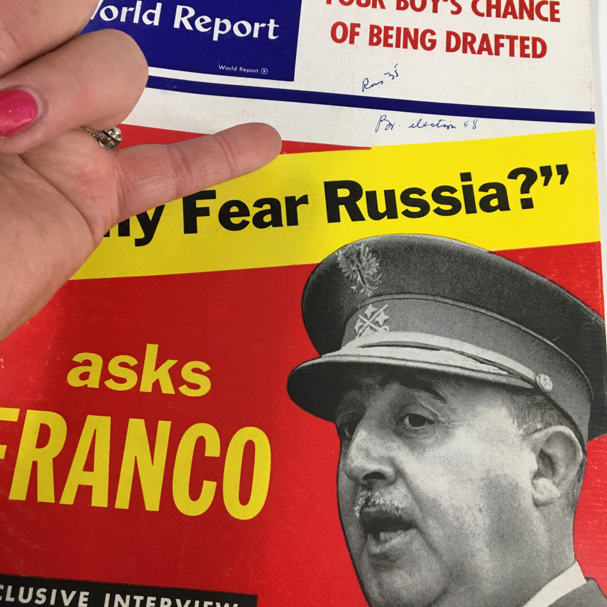 Detail of the cover of US News & World Report Magazine from May 20, 1955, highlighting the headline 'Your Boy's Chance of Being Drafted' and the phrasing 'Why Fear Russia?' with a finger pointing at the text.