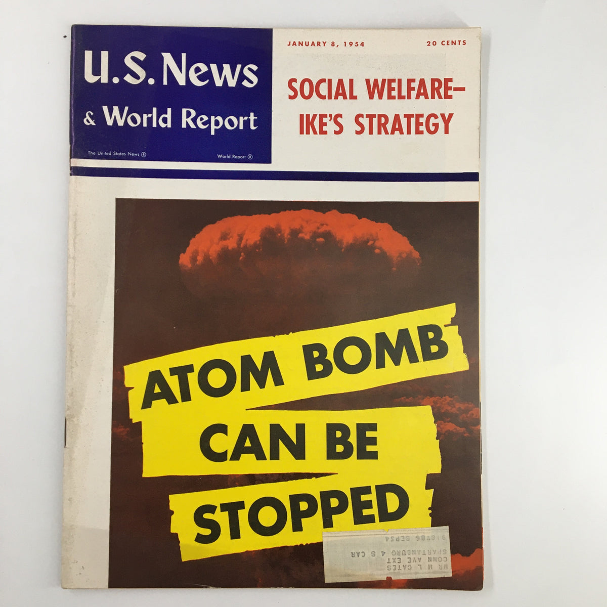 Cover of US News & World Report Magazine, January 8, 1954, featuring the headline 'Atom Bomb Can Be Stopped' alongside an image of a nuclear explosion.