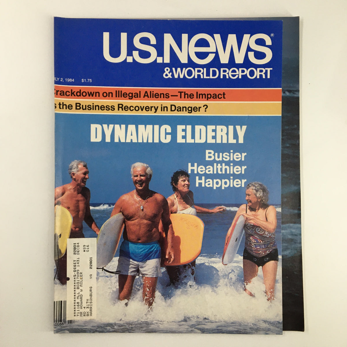 Cover of the US News & World Report Magazine from July 2, 1984, featuring a story on the crackdown on illegal aliens, with a vibrant image of elderly individuals enjoying the beach and surfing.
