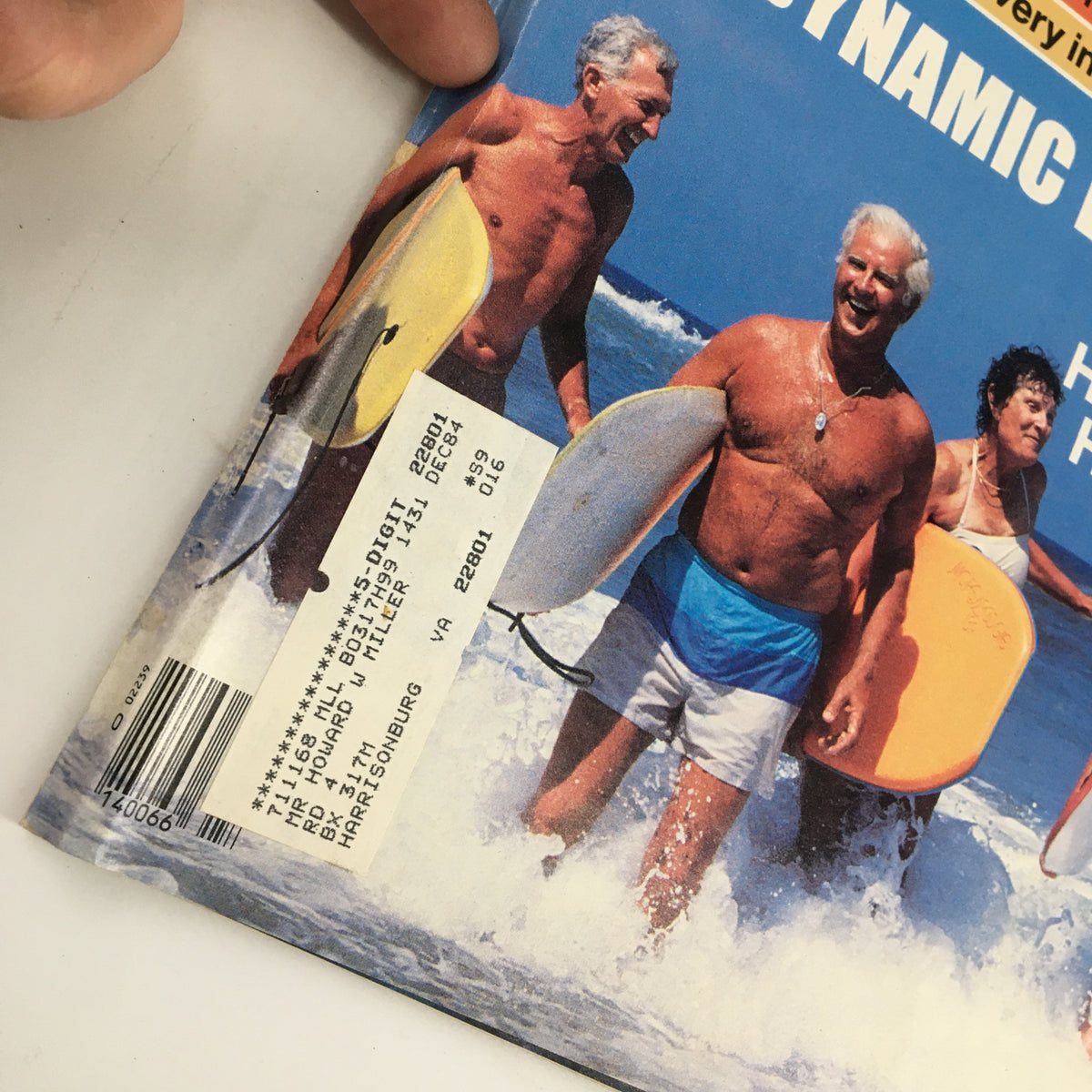 Close-up of the cover of the US News & World Report Magazine from July 2, 1984, showcasing the headline on the crackdown on illegal aliens and a group of active elderly people at the beach.