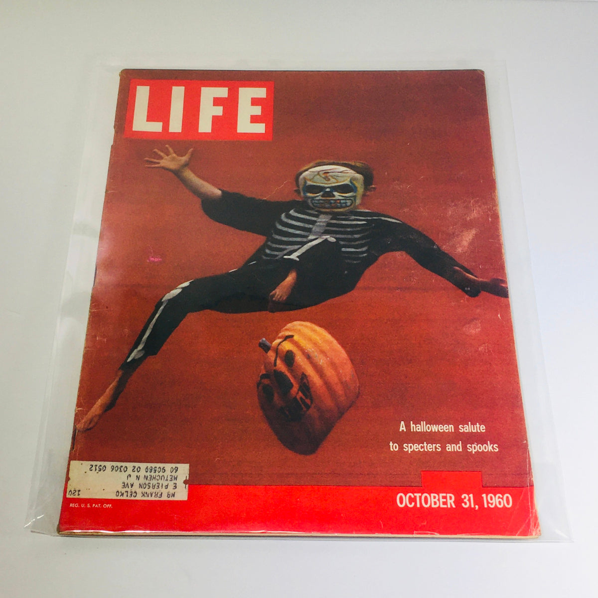 Vintage Life Magazine cover from October 31, 1960, featuring a child dressed in a skeleton costume, celebrating Halloween with a pumpkin, titled 'A Halloween Salute: Specters and Spooks'.