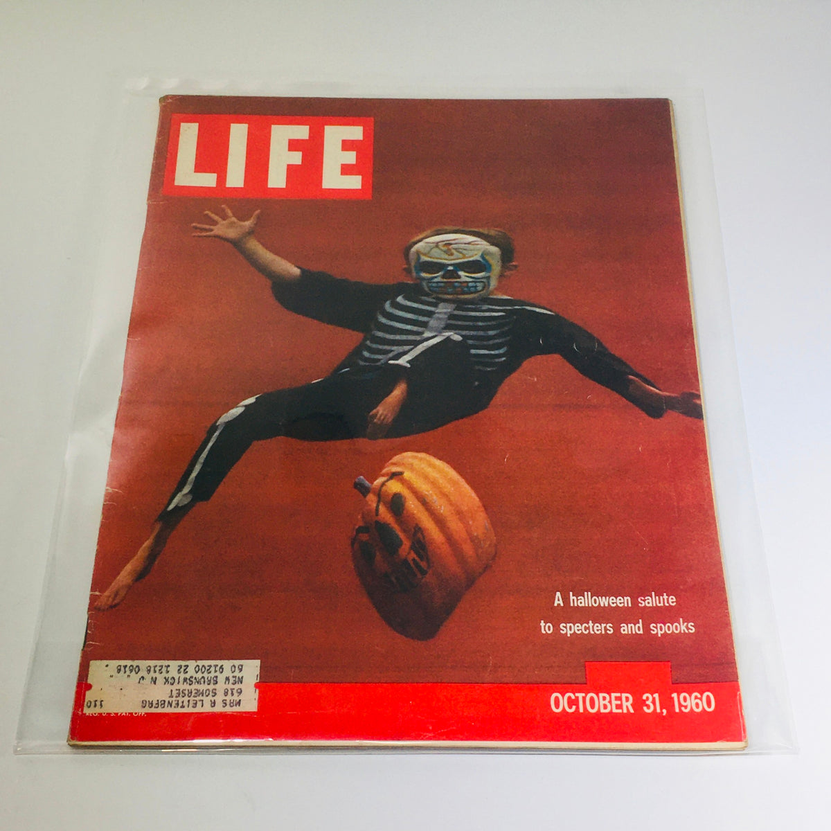 VTG Life Magazine: October 31, 1960 - Cover featuring a child in a skeleton costume and a pumpkin, celebrating Halloween with a salute to specters and spooks.