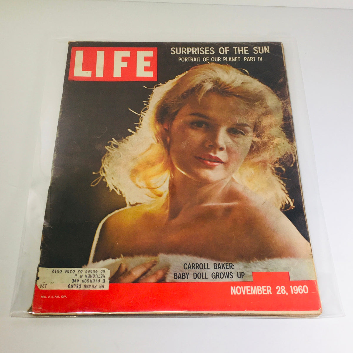 Vintage Life Magazine cover from November 28, 1960 featuring Carroll Baker in 'Baby Doll Grows Up' and 'Planet Part IV', showcasing mid-century media aesthetics.