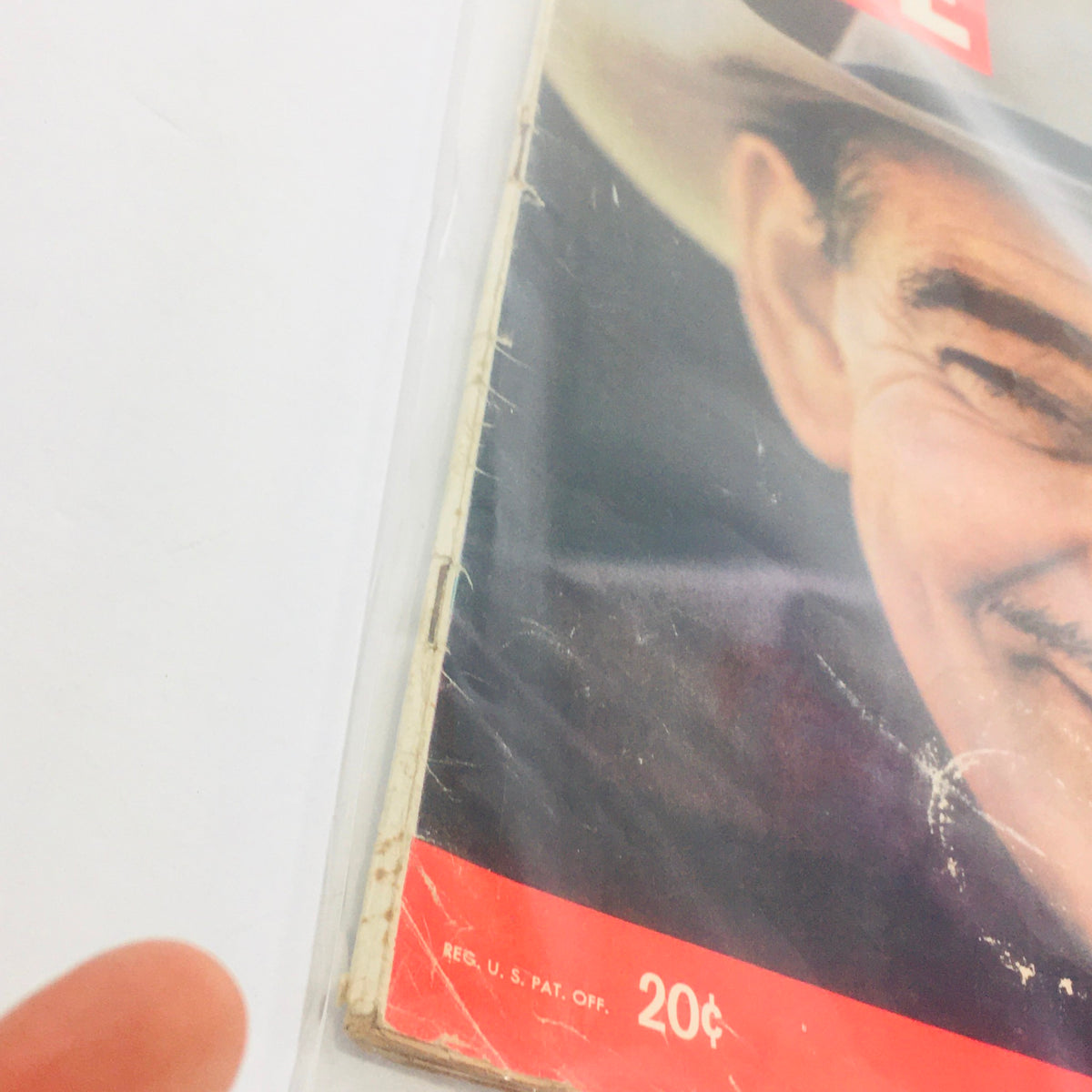 Close-up of Life Magazine dated January 13, 1961, displaying the cover with Clark Gable's image and signs of aging, including creases and a partial price.
