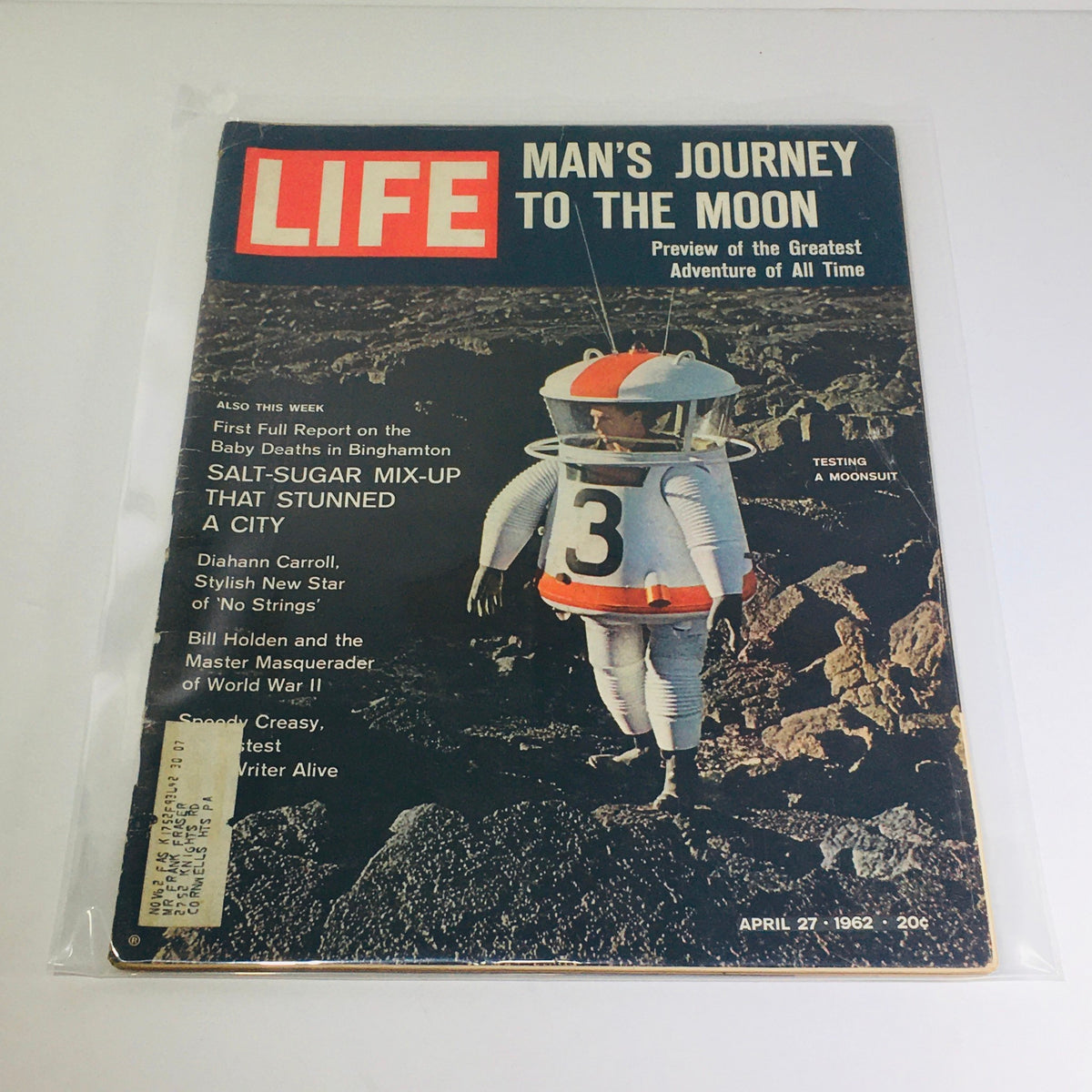 Vintage Life Magazine cover featuring 'Man's Journey To The Moon' and 'Salt-Sugar Mix Up', dated April 27, 1962, showcasing a helmeted astronaut in a moonsuit against a lunar landscape.