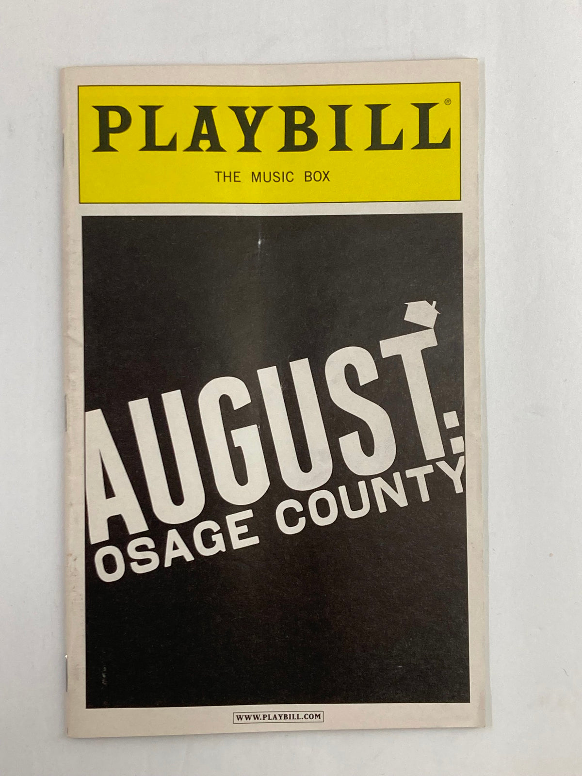 2008 Playbill for August: Osage County at The Music Box Theatre, featuring the play's iconic title in bold white letters against a black background.
