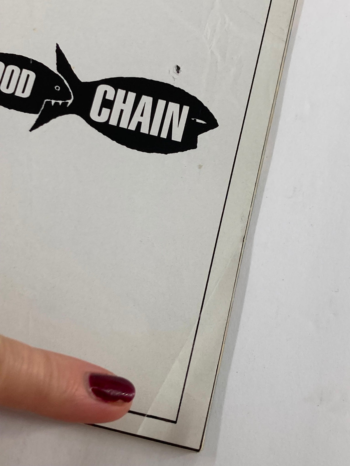 Close-up of the 1996 Playbill for The Food Chain, highlighting wear and detail on the cover.
