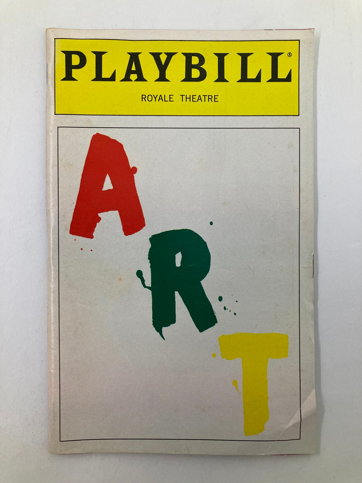 1998 Playbill from the Royale Theatre featuring the play 'Art' by Yasmina Reza, showcasing colorful bold letters on the cover.