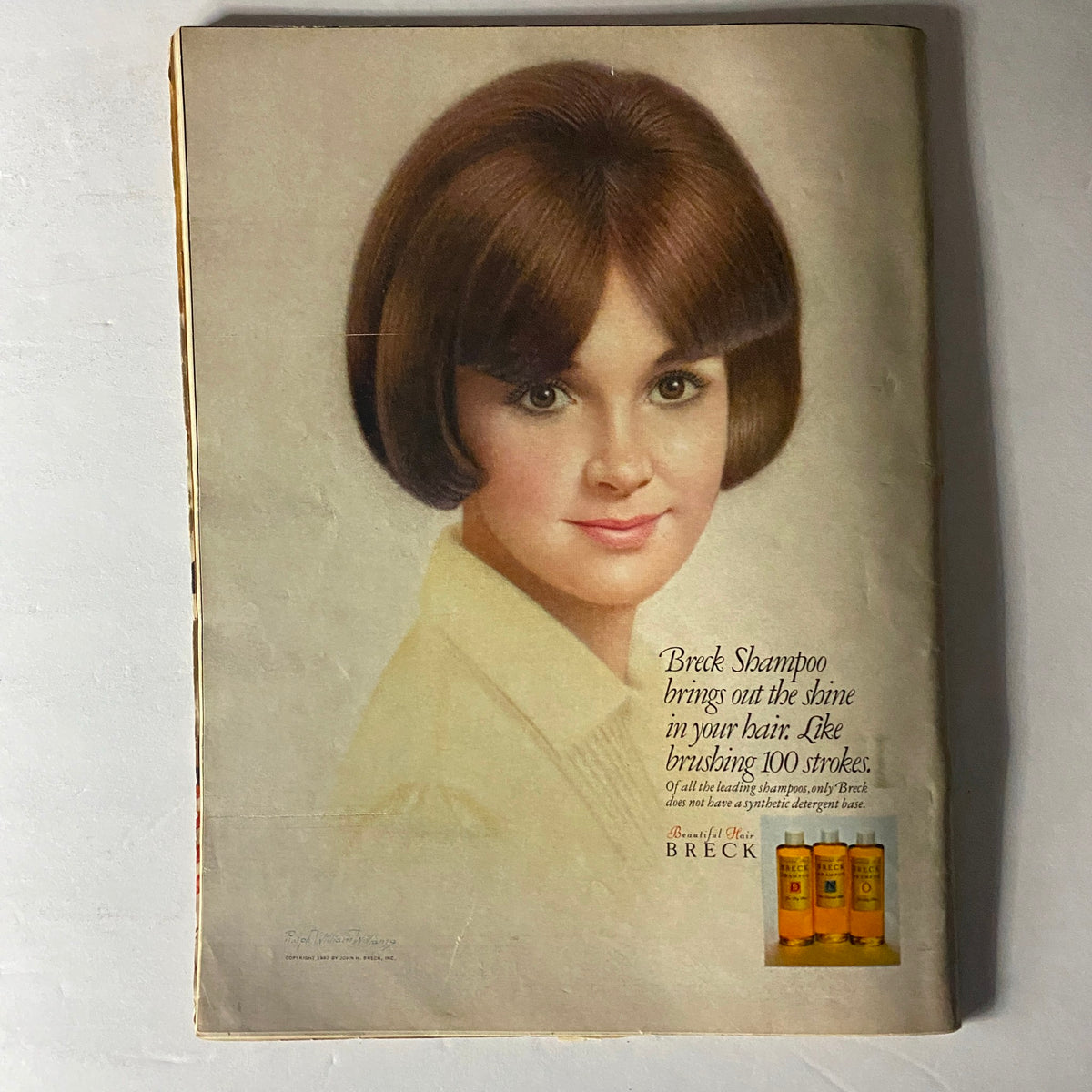 Cover of Teen Magazine September 1967, featuring a young girl with a bob haircut, advertising Breck Shampoo which claims to bring out shine in hair like brushing 100 strokes.