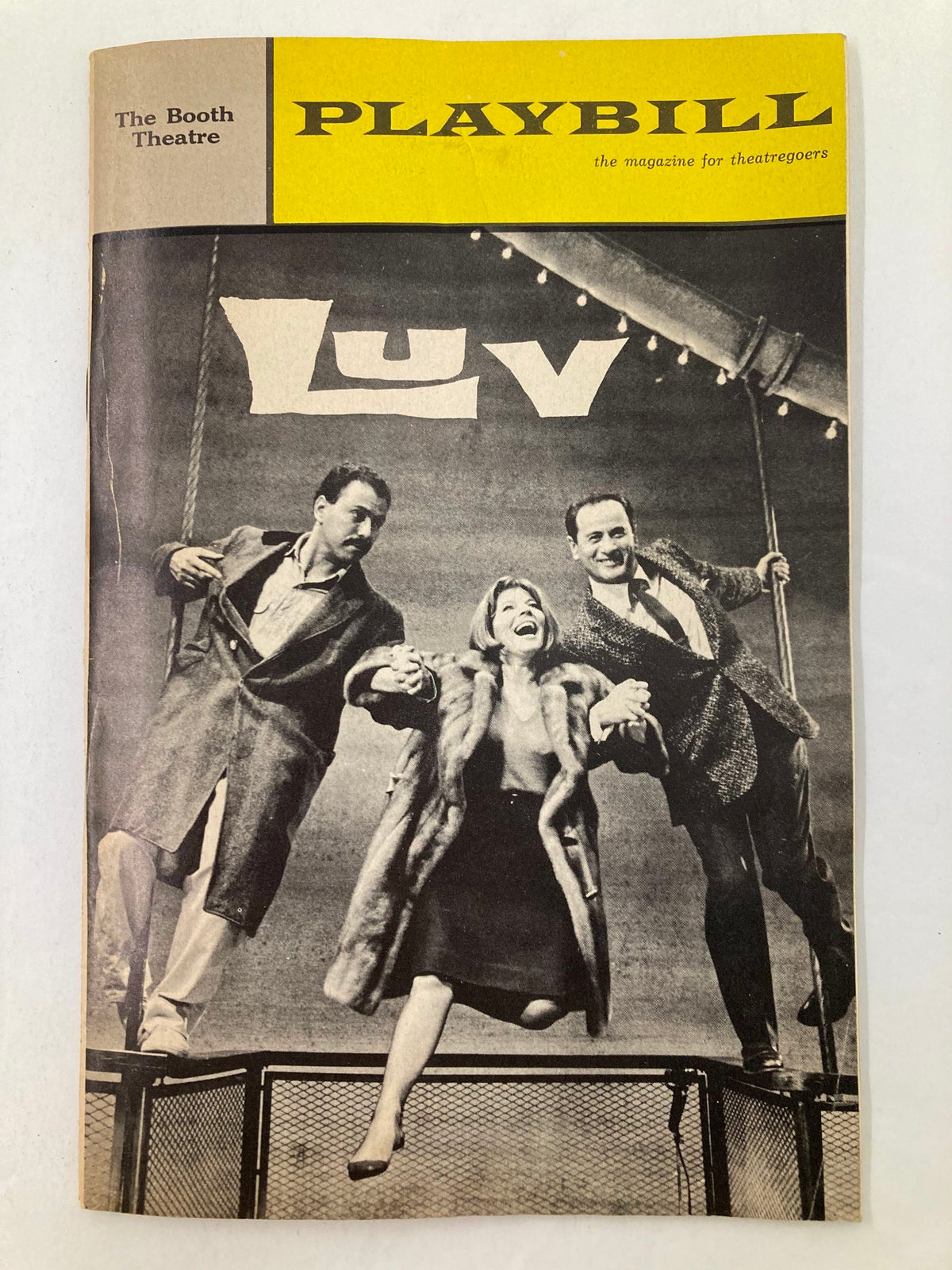 1965 Playbill from The Booth Theatre featuring Eli Wallach and Anne Jackson in the comedy 'Luv'. The cover showcases the title and a black-and-white image of the actors, highlighting this collectible piece of theater history.