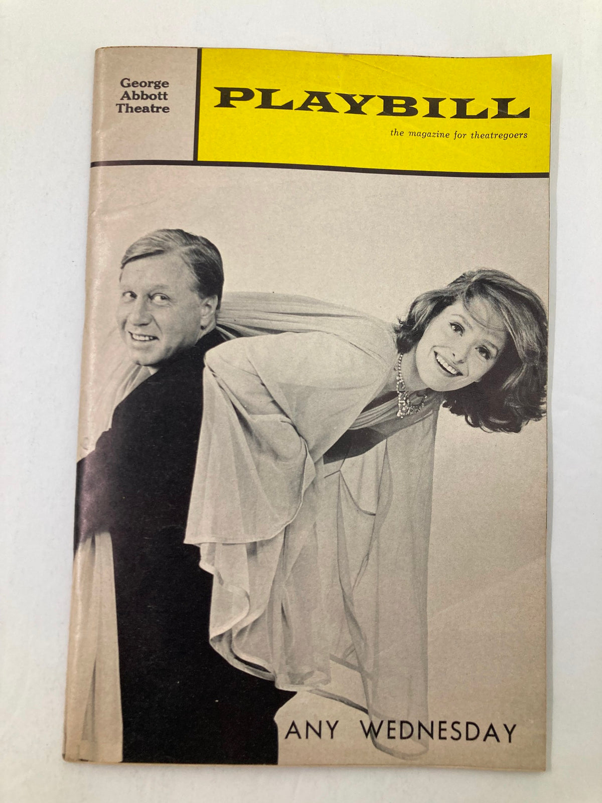 1966 Playbill for Any Wednesday at George Abbott Theatre featuring George Gaynes and Sandra Smith, presenting a classic moment in Broadway history.