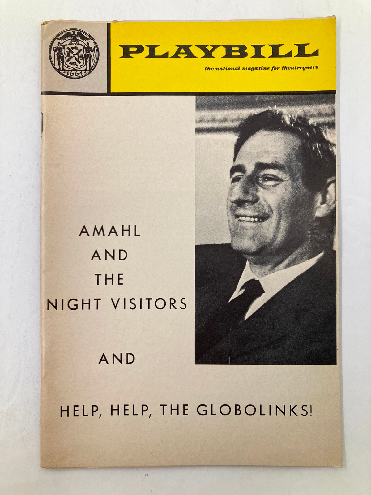 1969 Playbill for Gian Carlo Menotti's Amahl and The Night Visitors, featuring a smiling male figure on the cover, highlighting the theatrical production.