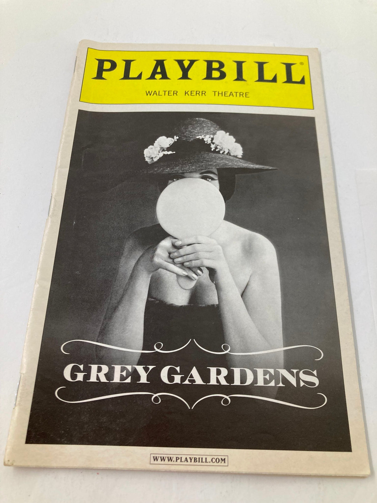 Front cover of the 2007 Playbill for Grey Gardens at Walter Kerr Theatre, showcasing a striking black and white image of a woman with a floral hat.