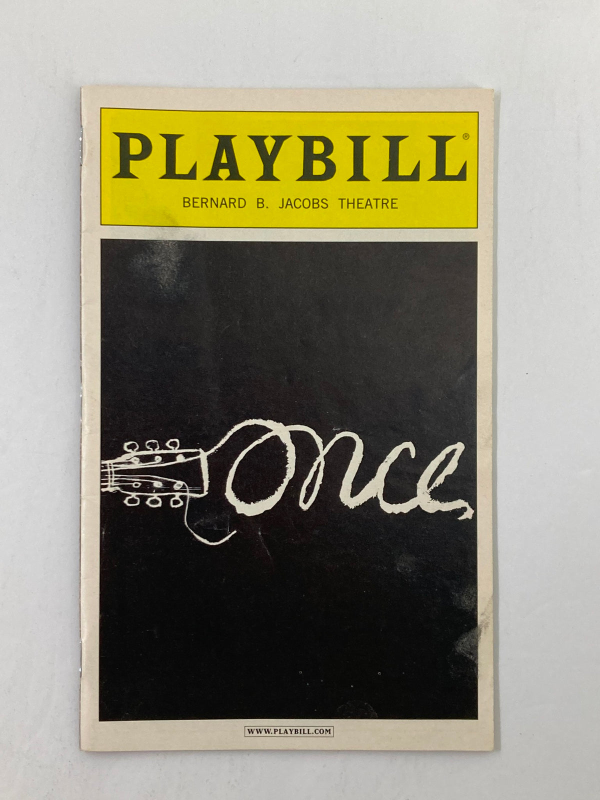 2012 Playbill for the musical Once at Bernard B. Jacobs Theatre, featuring the iconic cover design with a guitar and the word 'Once'.